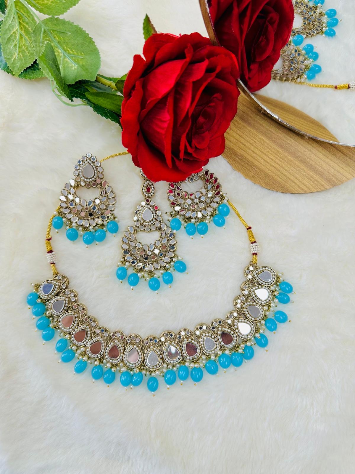 Mirror set with earrings and tikka.
