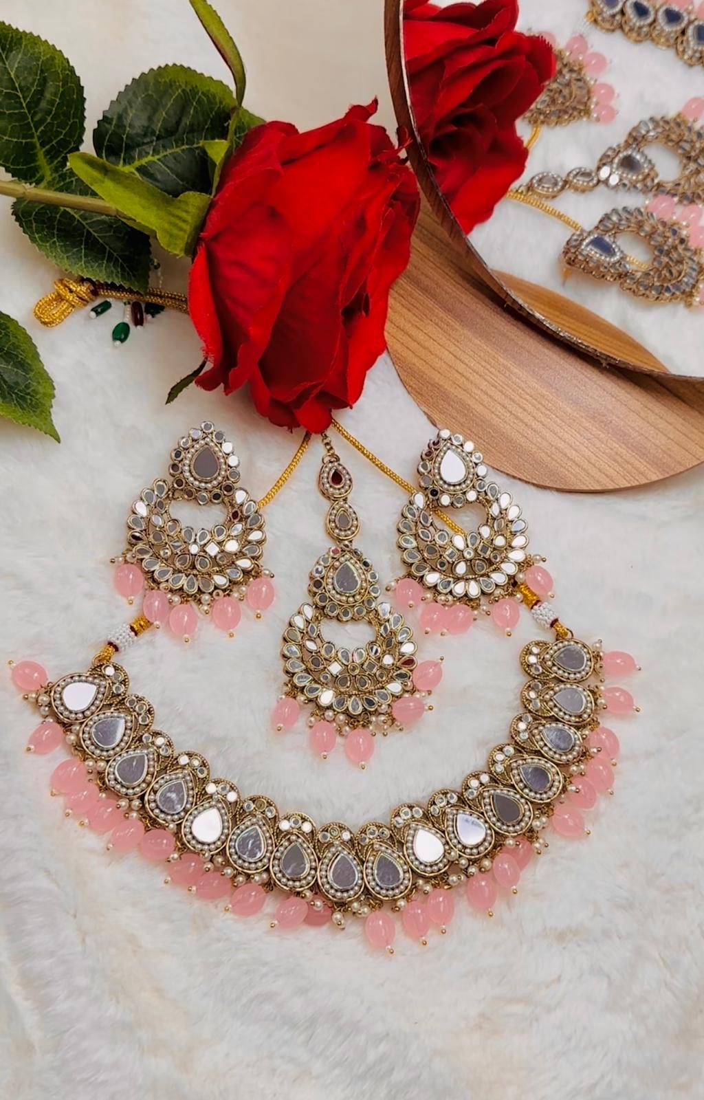 Mirror set with earrings and tikka.
